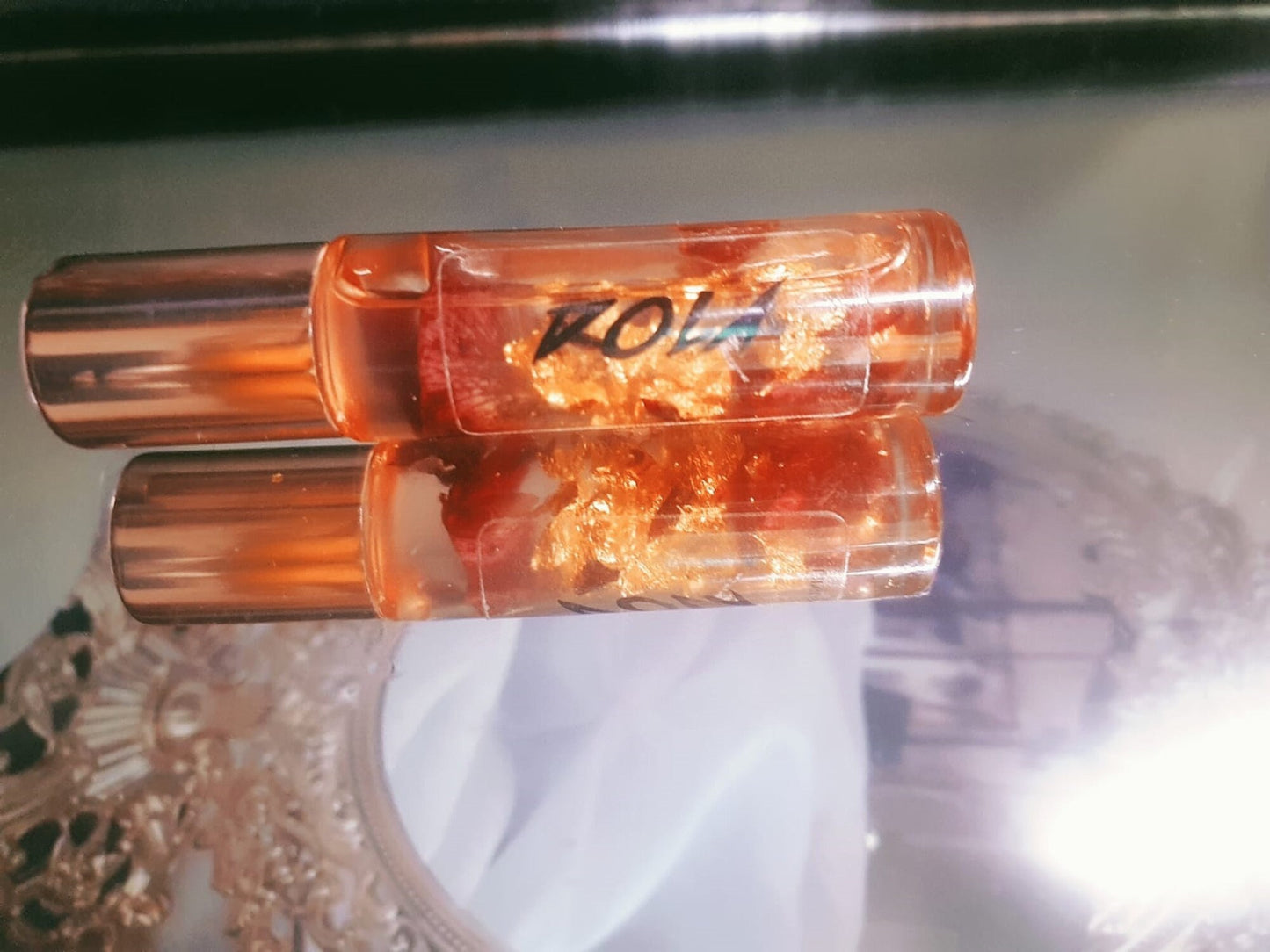 Transparent Lip Oil with Dry Rose Petals and Gold Sheet Flakes by DOLA