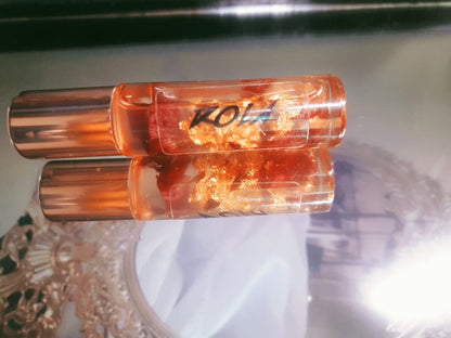 Transparent Lip Oil with Dry Rose Petals and Gold Sheet Flakes by DOLA